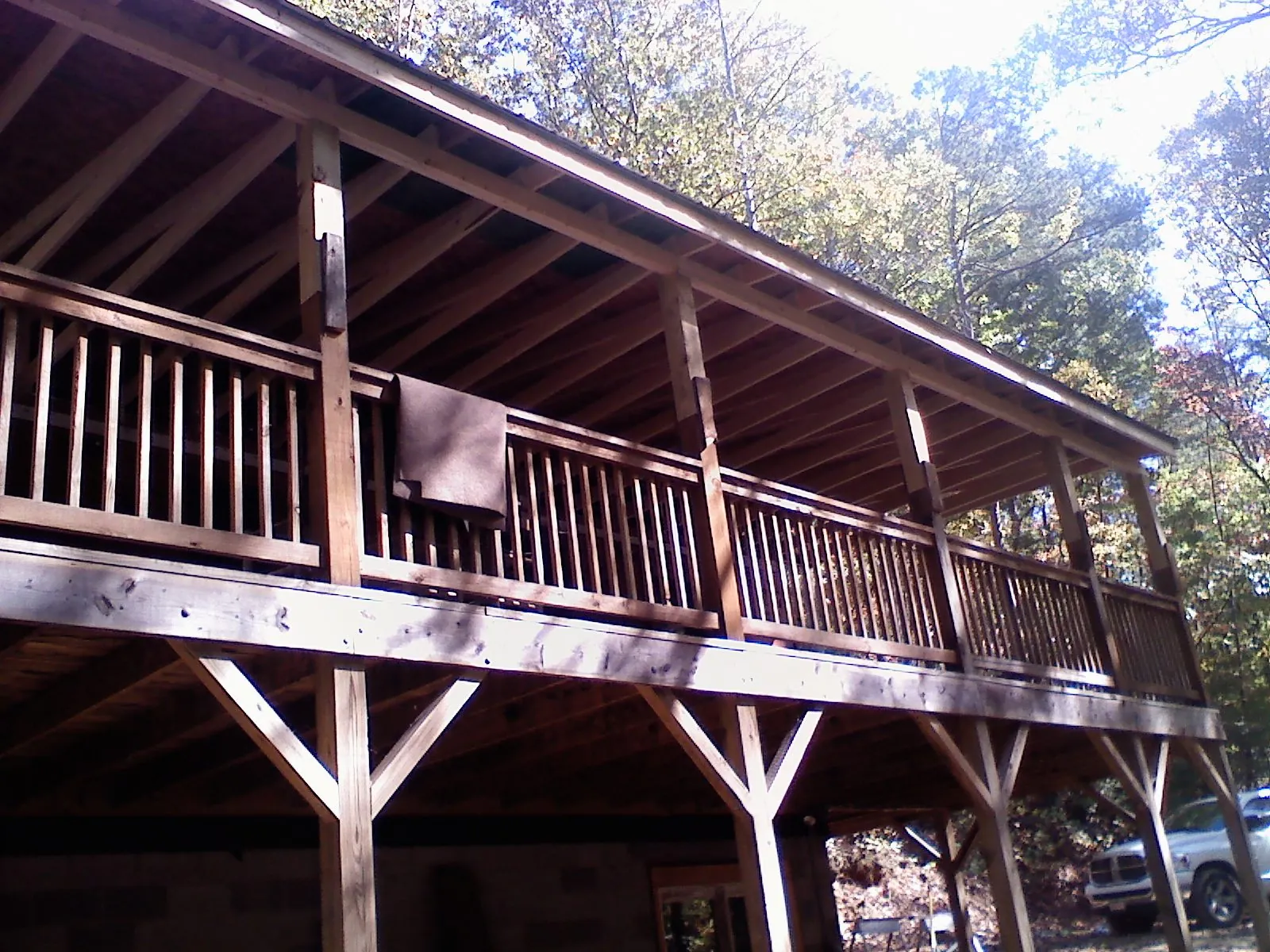 Timber framing under a new elevated porch and deck — Roof Leak Repair in Merrimack by Roofing Brothers